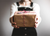 Person holding a Christmas Present (Photo by Kira auf der Heide)